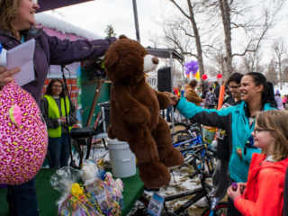 prize winner getting stuffed bear