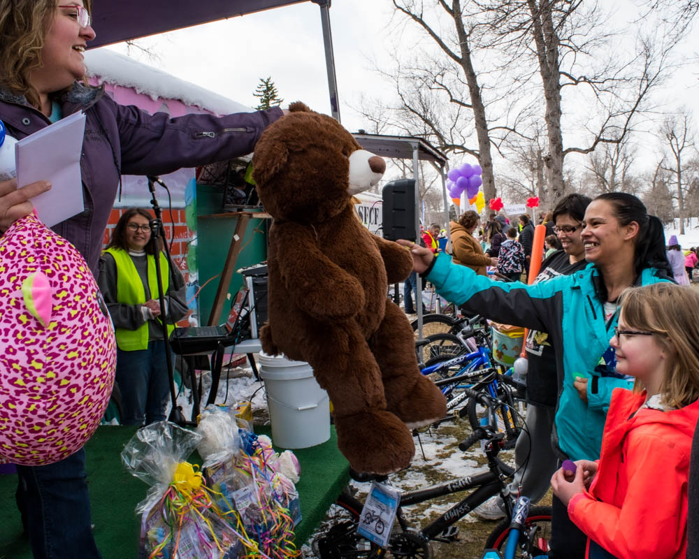 prize winner getting stuffed bear