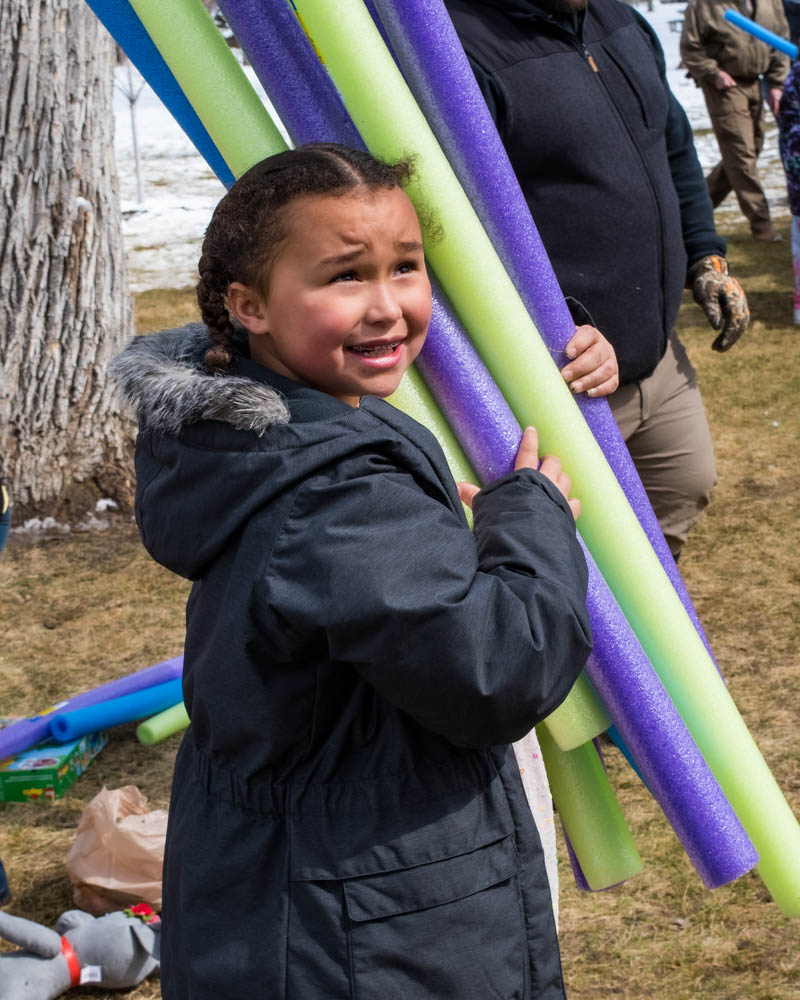 girl with pool noodles