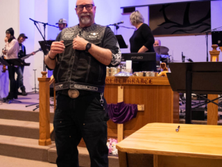 Pastor JT smiling at the front of the Set Free Sanctuary.